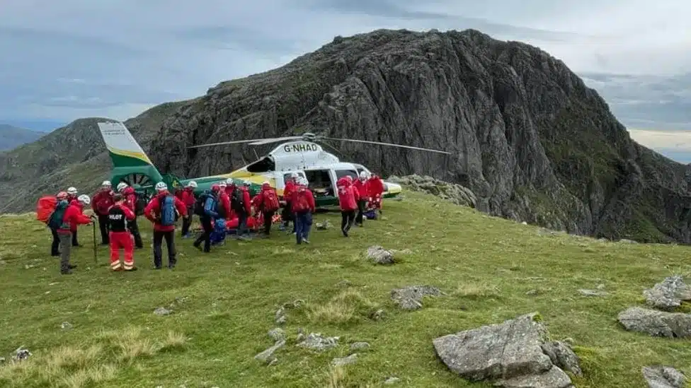 Three teams of rescuers were involved in the seven-hour mission to bring the walker to safety