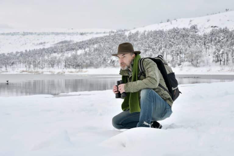 Man by the lake in winter